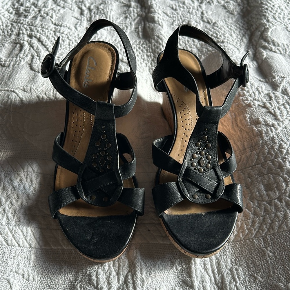 Clarks size 6.5 black leather upper wedge sandal.